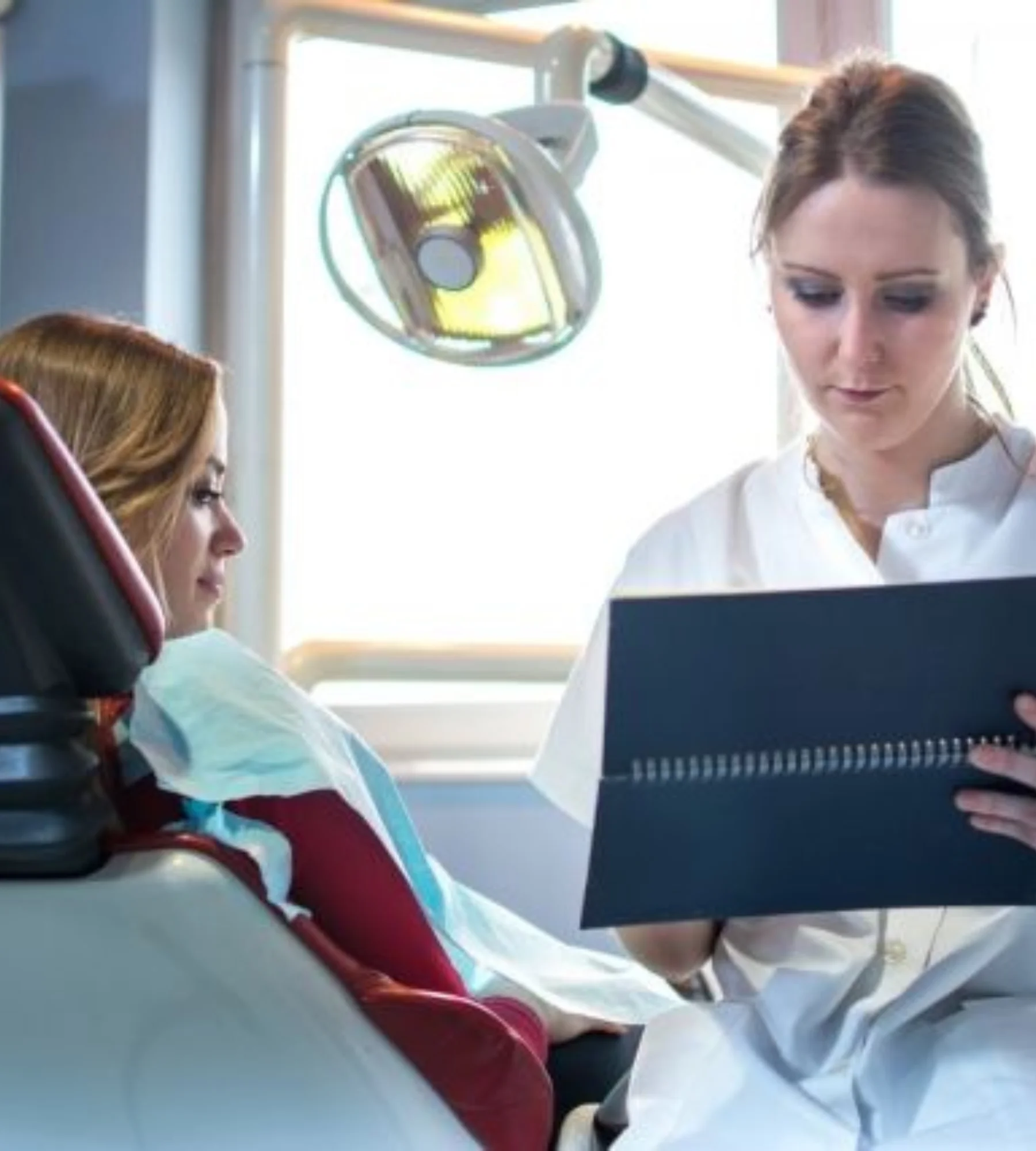Orthodontic specialist reviewing patient files